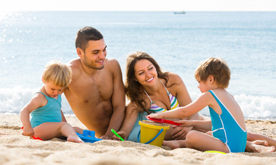 Family of four at the beach