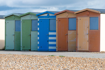 Obraz na płótnie Canvas Colourful beach hits on the promenade at Seaford in East Sussex.