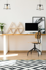 Wooden triangle shelves on desk