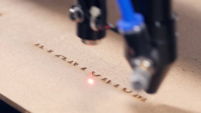 Laser engraving machining working. 4K.