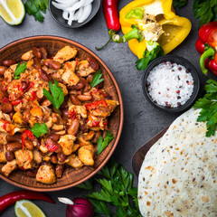 Cooking Mexican taco with meat beans and vegetables.