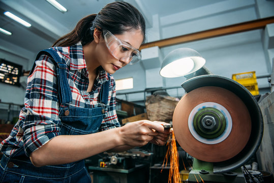 factory female staff wearing safety goggles