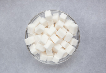 Sugar, food ingredient on gray background