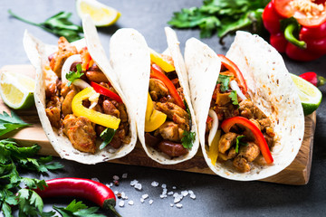 Mexican taco with meat beans and vegetables.