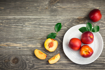 Fresh summer friuts on rustic wooden background. Top view copy space.