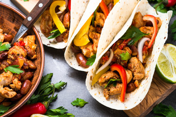 Mexican taco with meat beans and vegetables. Traditional latin american street food menu.