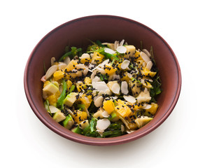 Bowl of original asian salad with fruits and vegetables isolated at white