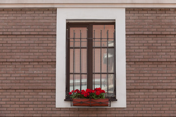 Old brick wall with brick filled window