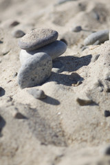 Fototapeta na wymiar Stones in the sand on the beach