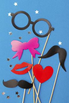 Party background with funny props on a blue background. Wedding party photobooth.