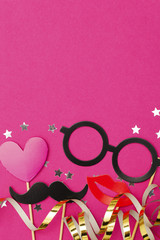 Fun party props on a pink background. Wedding, hen do party photobooth.