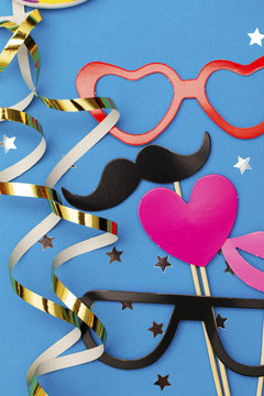 Party background with funny props on a blue background. Wedding party photobooth.