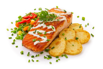Salmon Steak with Vegetables and fried potatoes.