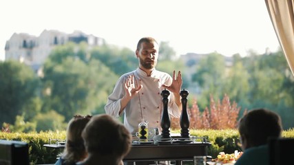 Show Kitchen. The cook prepares Carpaccio for the guests of the restaurant