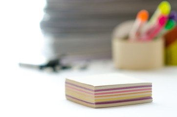 On a white table colorful block for notes