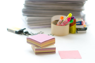 On a white table colorful block for notes