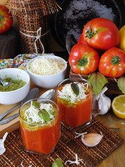 Tomato soup with pesto sauce and bryndza cheese in a glass. Village style