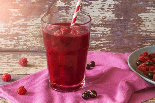 Berry smoothie. Smoothies with raspberries and black currants. Summer Drink. Bright and healthy cocktail