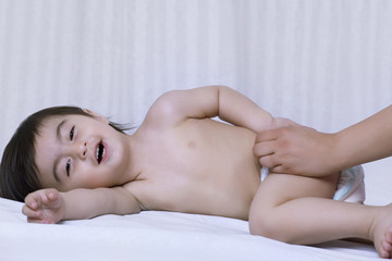Obraz na płótnie Canvas Little boy lying on a bed 