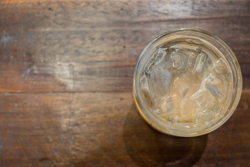 glass of water on a wooden table