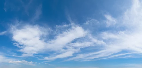  Panoramic blue sky background with white clouds on a sunny day © sirintra