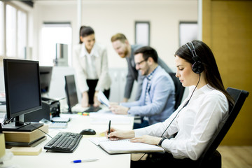 Team of young colleagues working together in an office