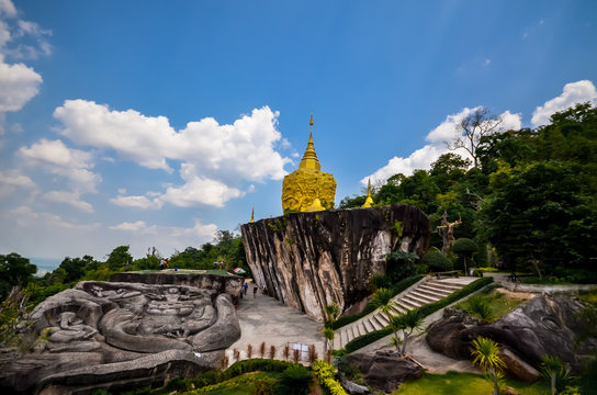 golden pagoda and golden stone at wat tham pha daen in sakon nakhon thailand.