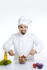 Portrait of chef with vegetables in bowl