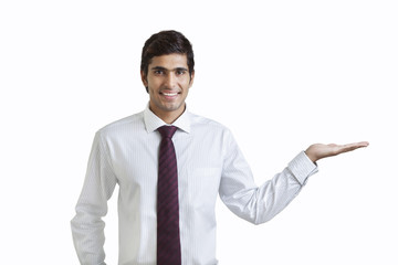 Portrait of business executive with extended hand