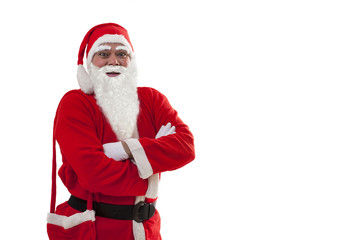 Front view of Santa Claus standing with arms crossed over white background 