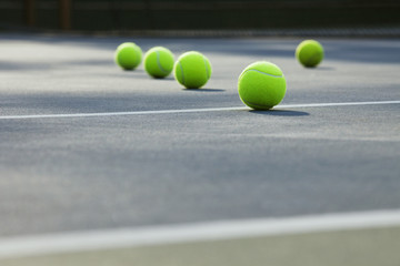 Close-up of tennis balls lying on ground 