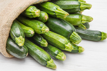 canvas sack full of zucchini