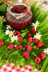 Raspberries. Jar with raspberry jam and fresh berries.