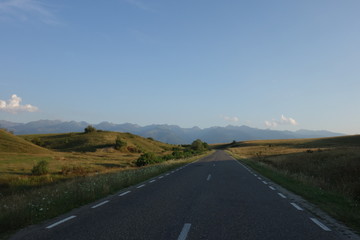 Road in Transylvania, Romania with Fagaras mountains in the background