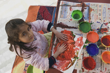 Fototapeta premium Little girl painting 