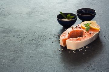 Raw salmon fillet with peppers and sea salt