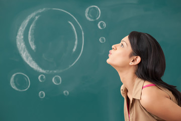 Female college student blowing