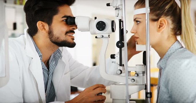 optometrist checking patient eyesight and vision correction