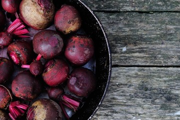 Fresh beetroot on an old cast-iron frying pan