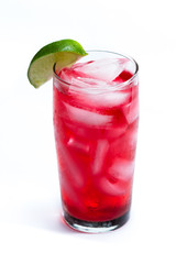 red cocktail with a lime