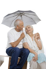 Old couple under an umbrella 