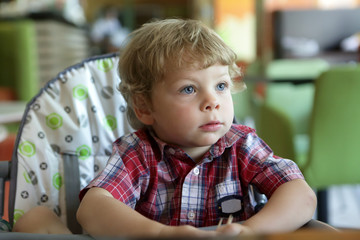 Boy in highchair