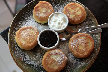 Fritters with cream and jam