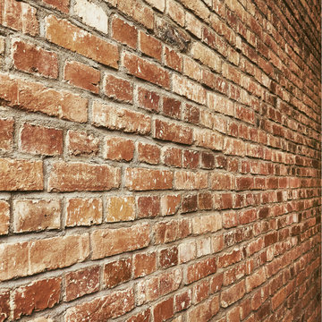 Old vintage brick wall perspective texture for square background