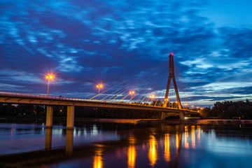 Fototapeta na wymiar Swietokrzyski bridge over the Vistula river in Warsaw, Poland