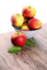 Ripe red apples on wooden background summer concept