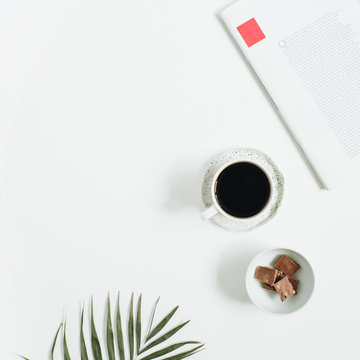 Morning breakfast with coffee cup and chocolate with tropical palm leaf and  magazine on white background. Flat lay, top view women background. Stock  Photo | Adobe Stock