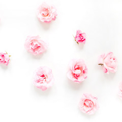 Pink rose buds pattern on white background. Flat lay, top view. Valentine's background. Pattern of flowers.