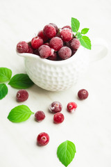 Cold cranberry in sauce pan with mint