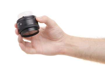 Fototapeta na wymiar Lens on a camera in a male hand